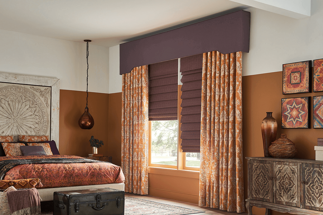 a warm bedroom with beautiful fabric drapes to make the space feel welcoming and homey