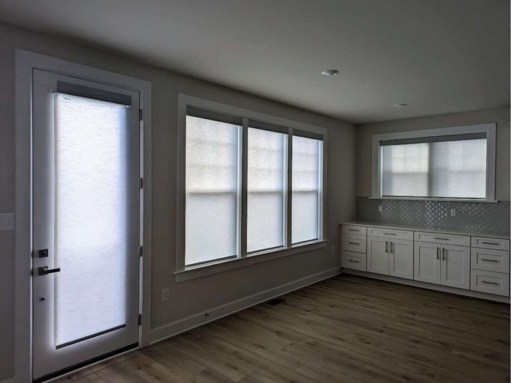 Modern roller shades on a large window