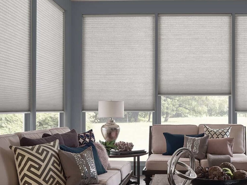 Cellular shades installed in a stylish living room for enhanced insulation and privacy