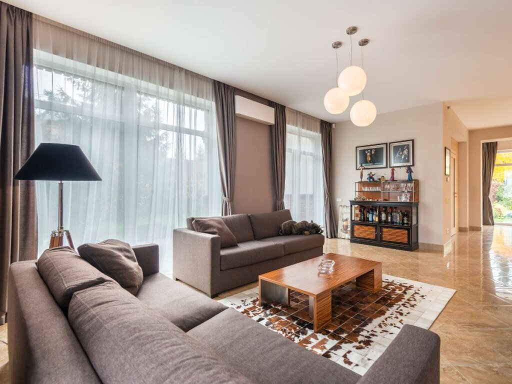 Living room enhanced with stylish sheer drapes for privacy and light control.