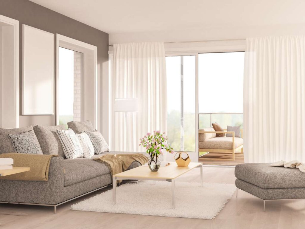 Soft, inviting atmosphere created by sheer drapes in a comfortable living room.