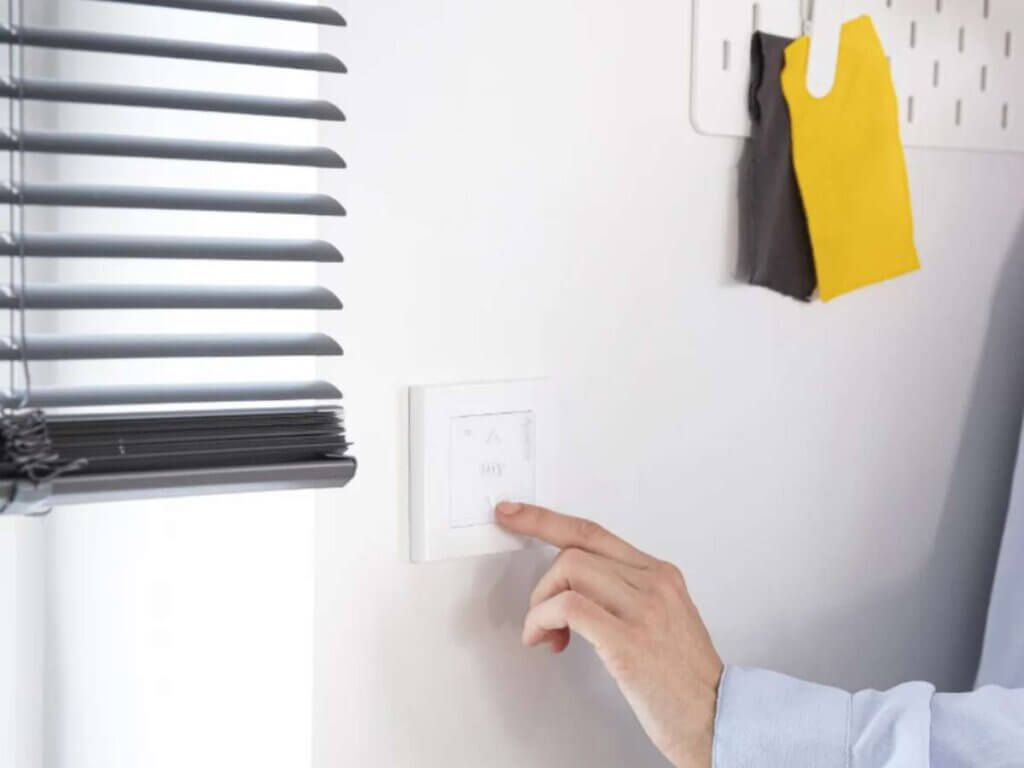 Motorized window treatments are powered by an electric motor, enabling you to open or close your window coverings remotely. Using a remote control, smartphone app, or even a wall switch, you can adjust blinds, shades, or curtains with the push of a button.
